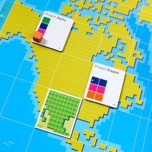 Load image into Gallery viewer, Colorful geometric tiles and cards on a blue grid background