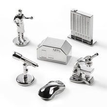 Load image into Gallery viewer, Collection of silver office supplies including a house-shaped phone, mouse, and other items on a white background.